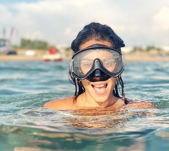 women snorkeling in the ionian sea